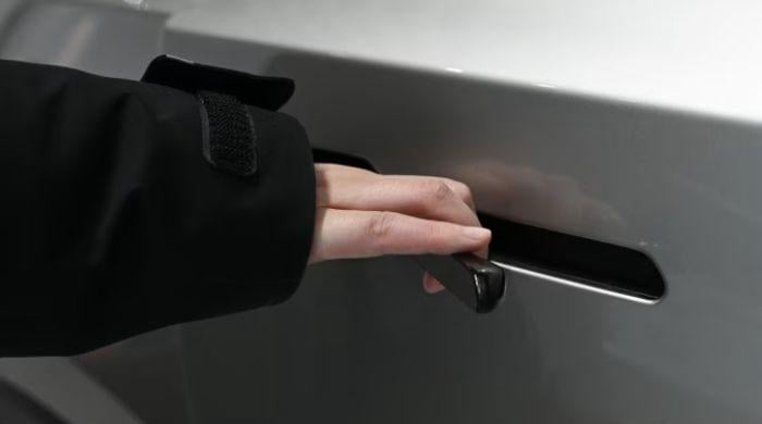 Why does China ban hidden door handles on EVs?