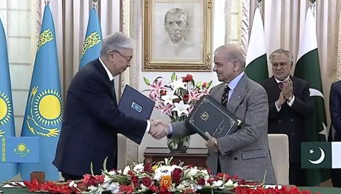 Prime Minister Shehbaz Sharif (right) and Kazakhstan President Kassym-Jomart Tokayev shake hands at MoU signing ceremony at Prime Minister House, Islamabad, February 4, 2026. — Screengrab via YouTube/Geo News