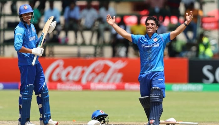 Afghanistans Uzairullah Niazai (right) celebrates his century in the second semi-final of the ICC U19 World Cup at the Harare Sports Club, Zimbabwe, February 4, 2026. — ICC