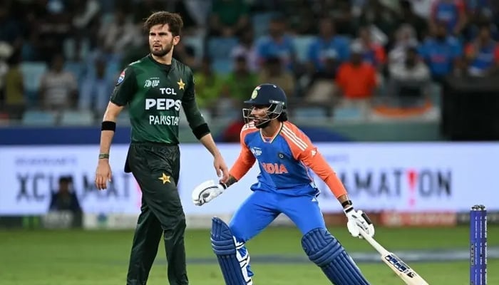 India’s Tilak Varma (right) runs between the wickets as Shaheen Shah Afridi watches during the Asia Cup 2025 Super Four Twenty20 international cricket match between India and Pakistan at the Dubai International Stadium in Dubai, September 21, 2026. — AFP