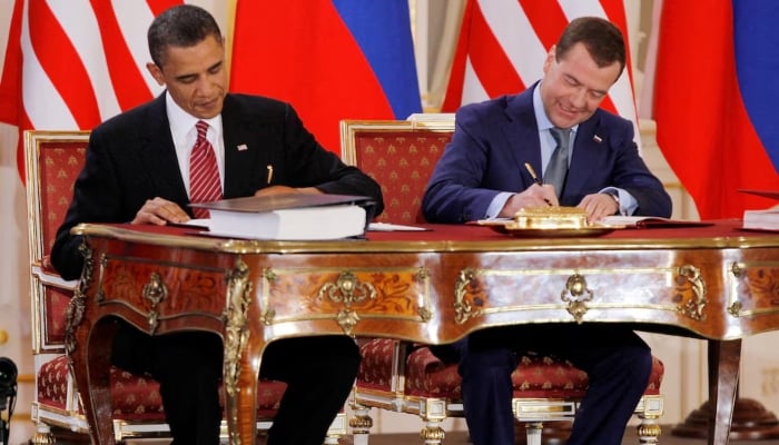 Barack Obama and Dmitry Medvedev, who were then the US and Russian presidents, sign the new Strategic Arms Reduction Treaty (START II) at Prague Castle in Prague, April 8, 2010. — Reuters