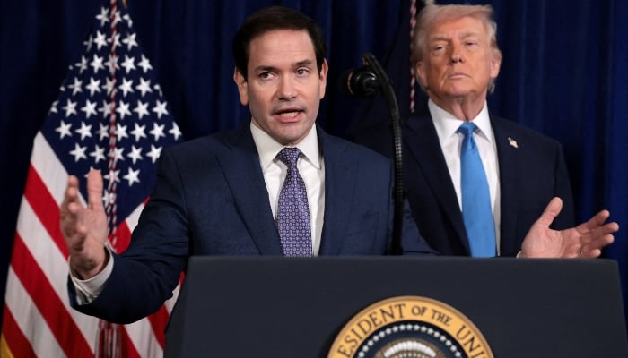 US Secretary of State Marco Rubio speaks as US President Donald Trump stands behind him during a press conference, from Trumps Mar-a-Lago club in Palm Beach, Florida, US, January 3, 2026. — Reuters