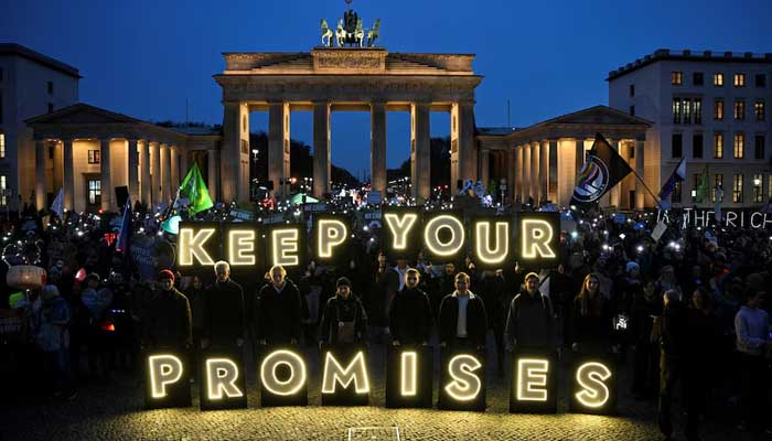 Demonstrators attend the Fridays for Future protest #JustTransitionNow next to the Brandenburg Gate during the United Nations Climate Change Conference (COP 30) which takes place in Belem, Brazil, in Berlin, Germany, November 14, 2025. — Reuters
