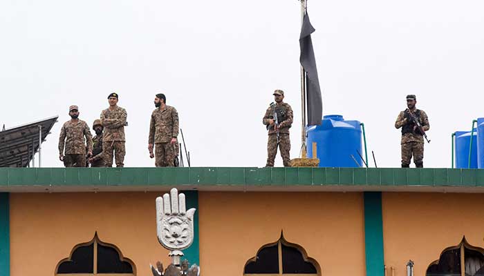 Army soldiers stand guard on the roof after a deadly explosion at a imambargah in Islamabad, February 6, 2026. — Reuters