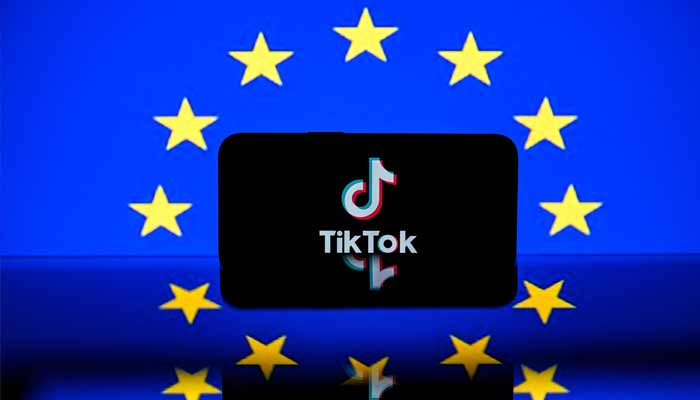 Tiktok social media platforms logo and the European flag. — AFP