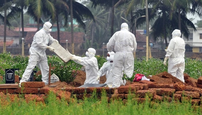 Representational image shows doctors and relatives wearing protective gear digging a grave to bury the body of a victim, who lost his battle against the brain-damaging Nipah virus, during his funeral at a burial ground in Kozhikode, in the southern Indian state of Kerala, May 24, 2018. — Reuters