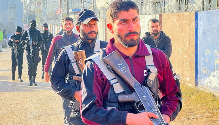 Police officers walk along a street following a deadly explosion at a mosque in Islamabad, on February 7, 2026. — Reuters