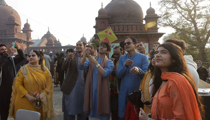 People gather as they fly kites to mark Basant, a kite-flying festival, in Lahore, February 6, 2026. — Reuters