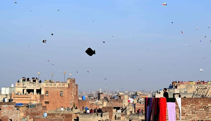People fly kites during the Basant festival in Lahore on February 6, 2026. — AFP