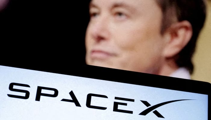 SpaceXs logo and an Elon Musk photo are seen in this illustration created on December 19, 2022. — Reuters