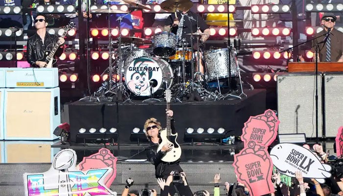 Green Day steers clear of political showdown during Super Bowl performance