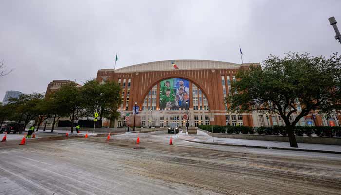 A representational image of Dallas, Texas, showing an exterior view of the arena and the ice on streets from the winter storm. — Reuters/File