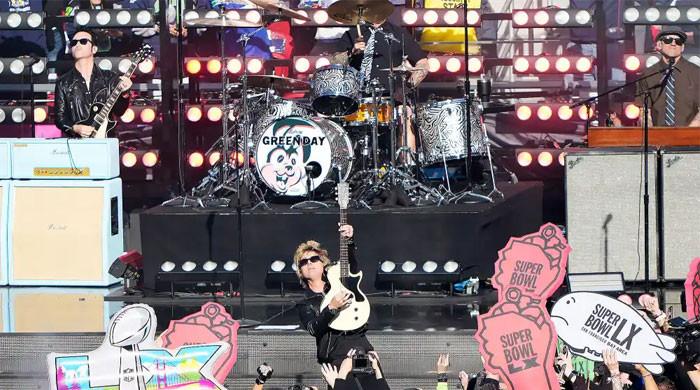 Green Day steers clear of political showdown during Super Bowl performance
