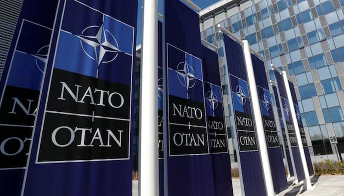 Banners displaying the NATO logo are placed at the entrance of new NATO headquarters during the move to the new building, in Brussels, Belgium April 19, 2018. — Reuters
