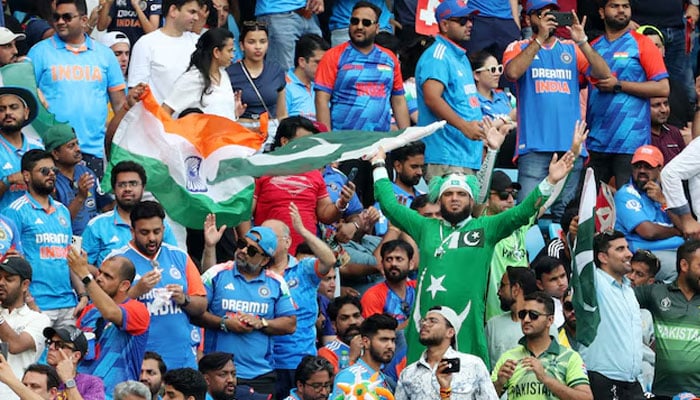 India and Pakistan fans react in the stand during the ICC Mens Champions Trophy match at Dubai International Stadium, February 23, 2025. — Reuters