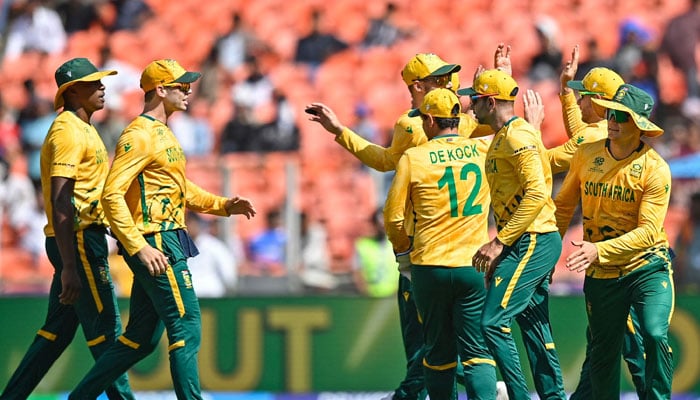 South Africa´s players celebrate after the dismissal of Afghanistans captain Rashid Khan during the ICC Men´s T20 World Cup  2026 group at the Narendra Modi Stadium in Ahmedabad on February 11, 2026. — AFP