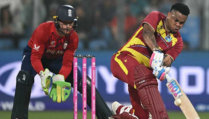 West Indies Shimron Hetmyer (R) plays a shot during the 2026 ICC Mens T20 Cricket World Cup group stage match between England and West Indies at the Wankhede Stadium in Mumbai on February 11, 2026. — AFP