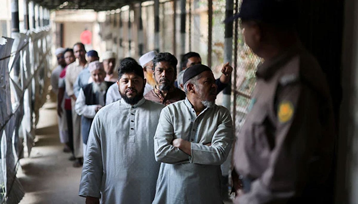 Voters stand in the queue at a polling station on the day of the 13th general election in Dhaka, Bangladesh, February 12, 2026. — AFP