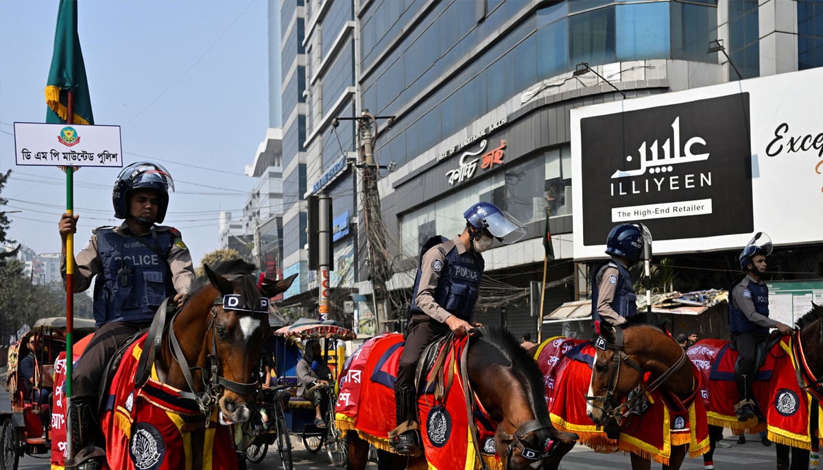 Police officers mounted on horses patrol a street during the national election in Dhaka, Bangladesh, February 12, 2026. — Reuters