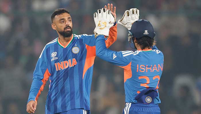 Indias Varun Chakaravarthy celebrates with wicketkeeper Ishan Kishan after taking wicket during the ICC Mens T20 World Cup group stage match against Namibia at Arun Jaitley Stadium, Delhi, on February 12, 2026. — Facebook/@IndianCricketTeam