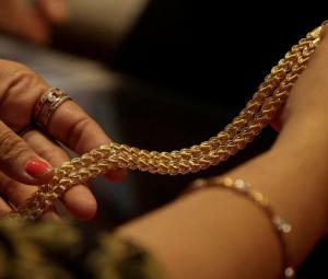 Shining gold, nervous economy