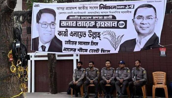 Police officers sit outside a party office of Bangladesh Nationalist Party (BNP), a day after the national election in Dhaka, Bangladesh, February 13, 2026.