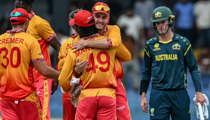 Zimbabwes Brian Bennett (C, back) celebrates with teammates after their teams win in the 2026 ICC Mens T20 Cricket World Cup group stage match between Australia and Zimbabwe at the R Premadasa Stadium in Colombo on February 13, 2026. — AFP