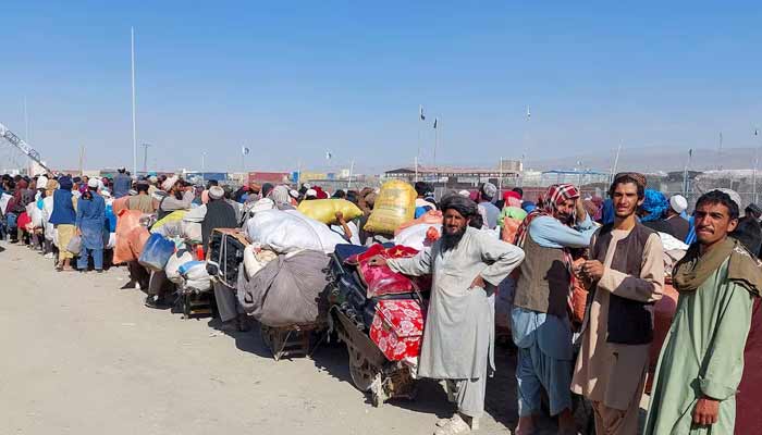 Afghan citizens wait with their belongings to cross into Afghanistan, after Pakistan gives the last warning to undocumented immigrants to leave, at the Friendship Gate of Chaman Border Crossing along the Pakistan-Afghanistan Border in Balochistan Province, in Chaman, Pakistan. — Reuters
