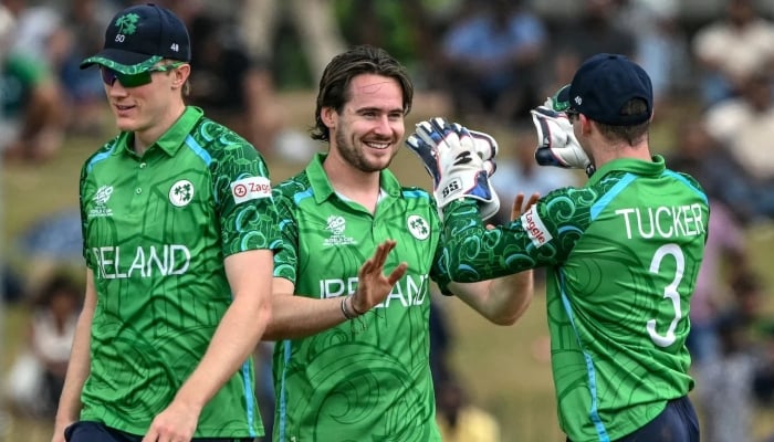 Irelands Josh Little (C) celebrates with teammates after taking the wicket of Omans Mohammad Nadeem during the 2026 ICC Mens T20 Cricket World Cup group stage match between Ireland and Oman at the Sinhalese Sports Club Ground in Colombo on February 14, 2026. — AFP