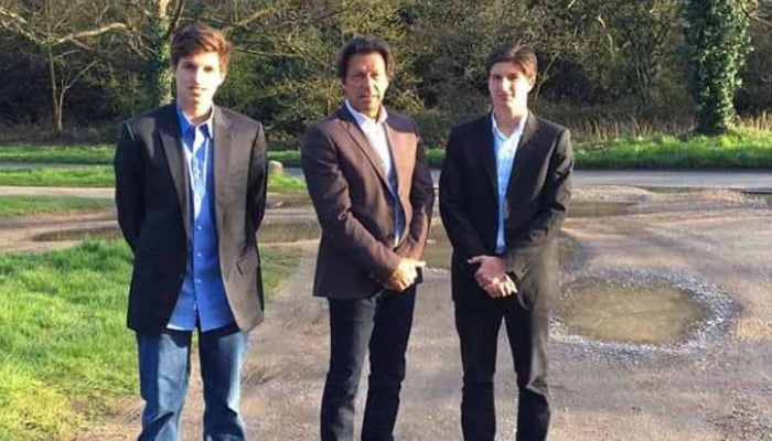 Pakistan Tehreek-e-Insaf founder Imran Khan (centre) poses with his sons Sulaiman Khan (left) and Kasim Khan. — X/@PTIofficial