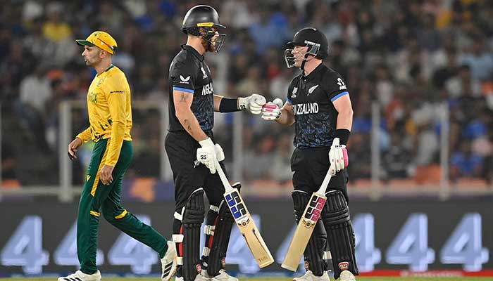 New Zealands Tim Seifert (R) and Finn Allen bump their fists during the 2026 ICC Mens T20 Cricket World Cup group stage match between New Zealand and South Africa at the Narendra Modi Stadium in Ahmedabad on February 14, 2026. — AFP