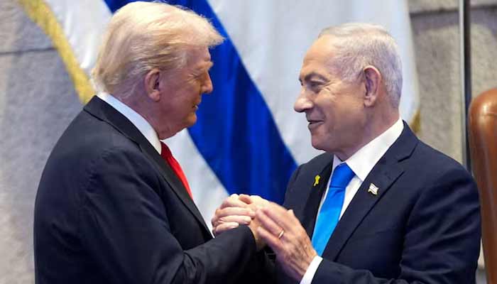 President Donald Trump talks with Israels Prime Minister Benjamin Netanyahu at the Knesset. — Reuters/File