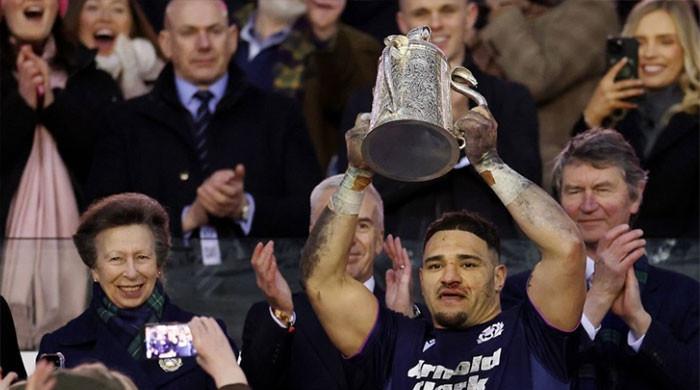 Princess Anne hugs Scotland captain after dragging husband to royal duties