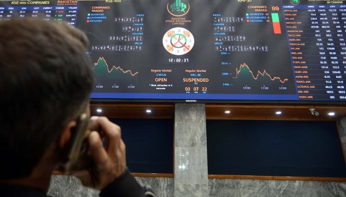 Broker is busy in trading at Pakistan Stock Exchange (PSX) in Karachi on Friday, January 2, 2026. — AFP