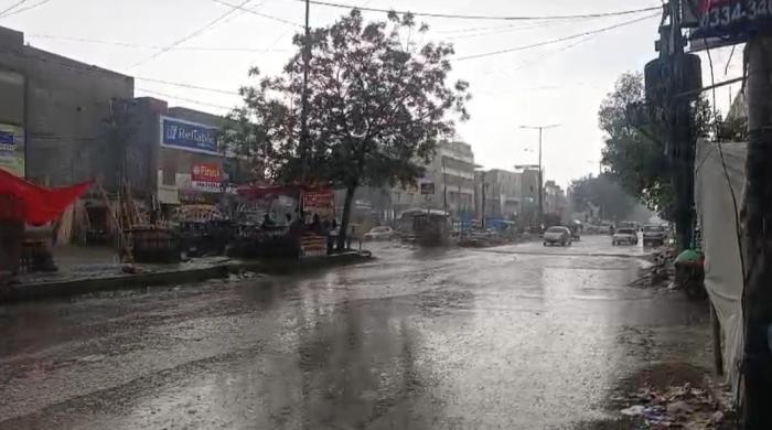Weather turns pleasant as parts of Karachi receive hail, rain
