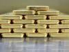 Gold falls on easing geopolitical risks, stronger dollar
