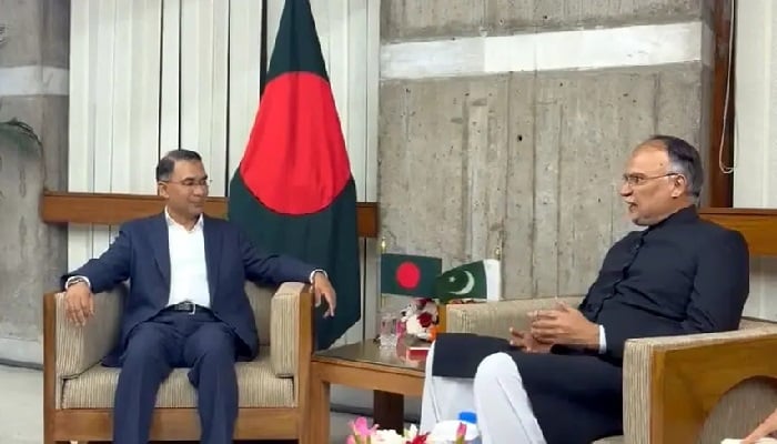 Bangladesh PM Tarique Rahman smiles as Planning Minister Ahsan Iqbal speaks to him during a meeting after his inauguration. — X@PlanComPakistan