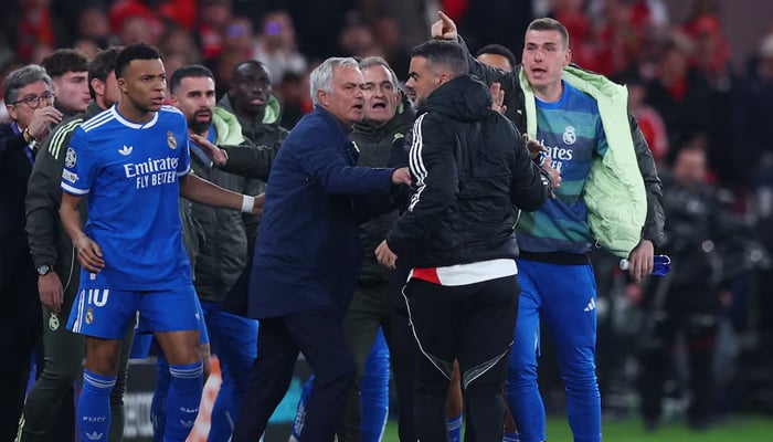 Real Madrids Kylian Mbappe with Benfica coach Jose Mourinho as the UEFA Champions League match was stopped due to racist chants at Estadio da Luz, Lisbon, Portugal, February 17, 2026. — Reuters