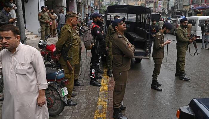 Police personnel patrol a market in Lahore on November 10, 2023. Punjab police registered case against two journalists on July 26 and July 29, 2025. — APP/File