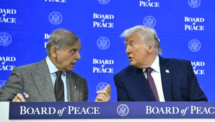 Prime Minister Shehbaz Sharif (left) speaks with US President Donald Trump at the “Board of Peace” meeting during the World Economic Forum (WEF) 2026 in Davos on January 22, 2026. — AFP