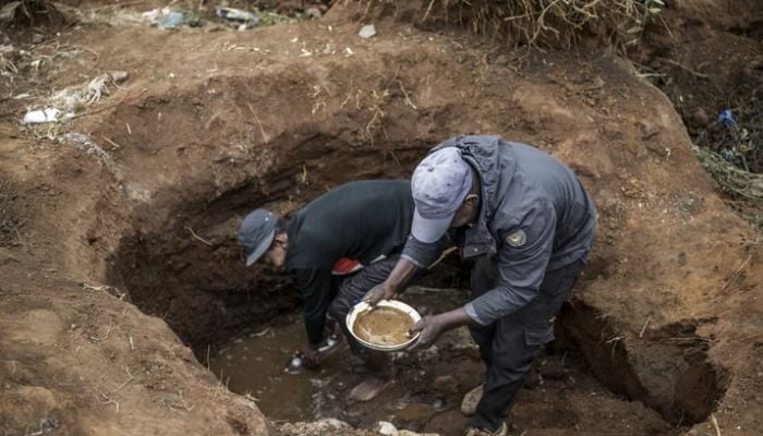 South African gold fever sparked as hundreds dig Johannesburg after man finds gold nuggets
