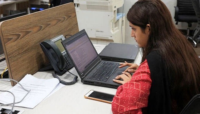 An employee works on a computer at the office of Pakistan Freelancers Association (PAFLA), a platform and support group to help freelancers, in Karachi, Pakistan on August 22, 2024.— Reuters