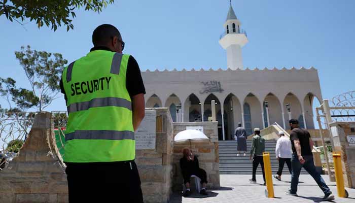 A security guard stands outside the Lakemba Imam Ali bin Abi Talib Mosque as people arrive for Friday prayers, amid a heightened security presence following the deadly mass shooting during a Jewish Hanukkah celebration at Bondi Beach on December 14, in Sydney, Australia. — Reuters/File
