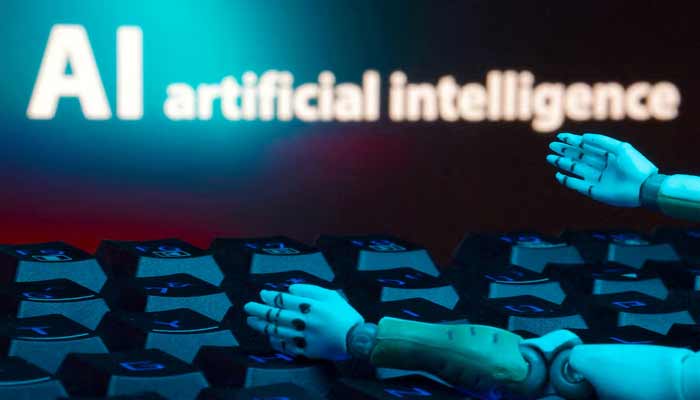 A message reading AI artificial intelligence, a keyboard, and robot hands are seen in this illustration taken January 27, 2025.— Reuters/File