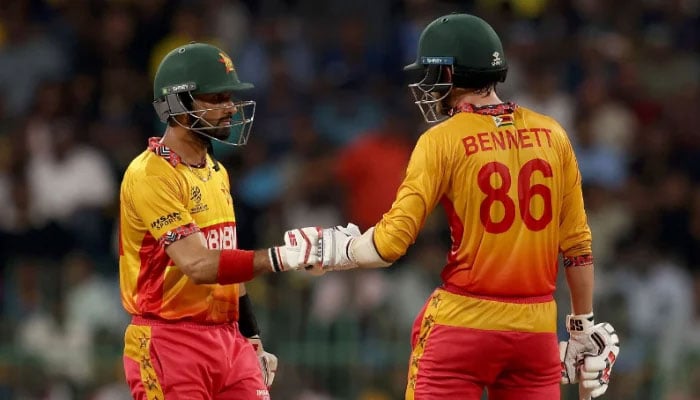Sikandar Raza and Brian Bennett of Zimbabwe fist bump during the ICC Mens T20 World Cup 2026 match against Sri Lanka at R. Premadasa Stadium on February 19, 2026 in Colombo, Sri Lanka. — ICC