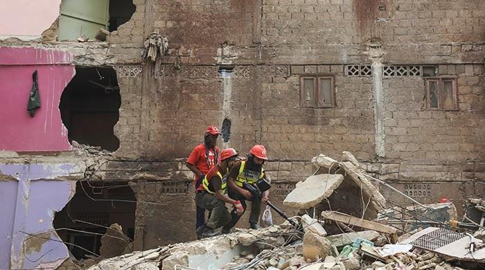 At least seven killed as first-floor gas blast brings down part of building in Karachi