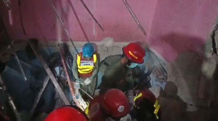 At least 13 killed as first-floor gas blast brings down part of building in Karachi
