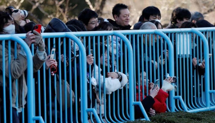 Visitors watch a baby Japanese macaque named Punch at Ichikawa City Zoo, in Ichikawa, Chiba Prefecture, Japan, February 19, 2026. — Reuters