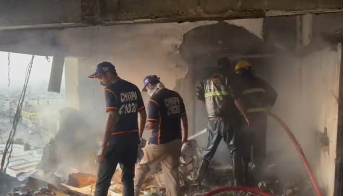 Rescue workers operate in an apartment following an explosion, Karachi, February 22, 2026. — Reporter