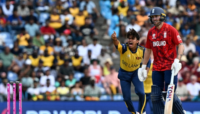Sri Lanka´s Dunith Wellalage (left) celebrates after taking the wicket of England´s captain Harry Brook as and Phil Salt looks on during their 2026 ICC Men´s T20 Cricket World Cup Super Eights match at Pallekele International Cricket Stadium, Kandy on February 22, 2026. — AFP